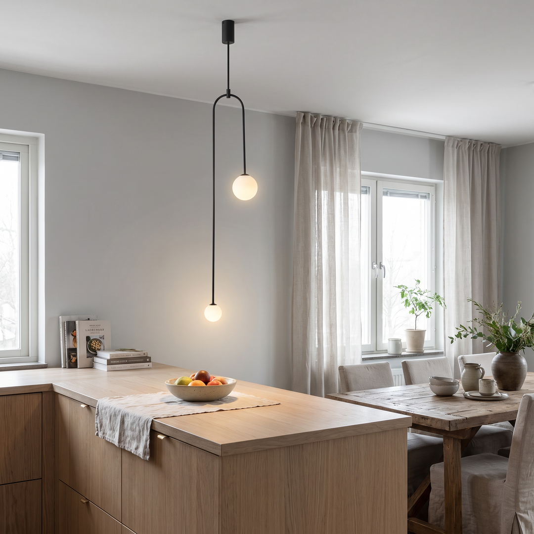 Column black and gold pendant light in a Scandinavian interior