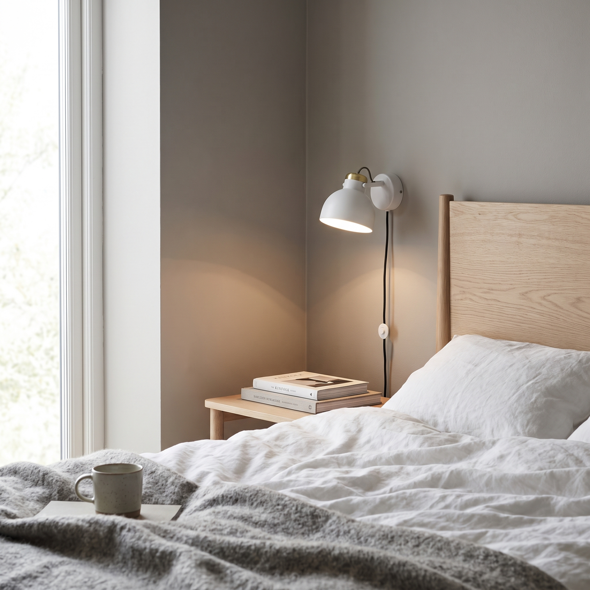 Notch minimalist plug-in wall sconce in a Scandinavian bedroom