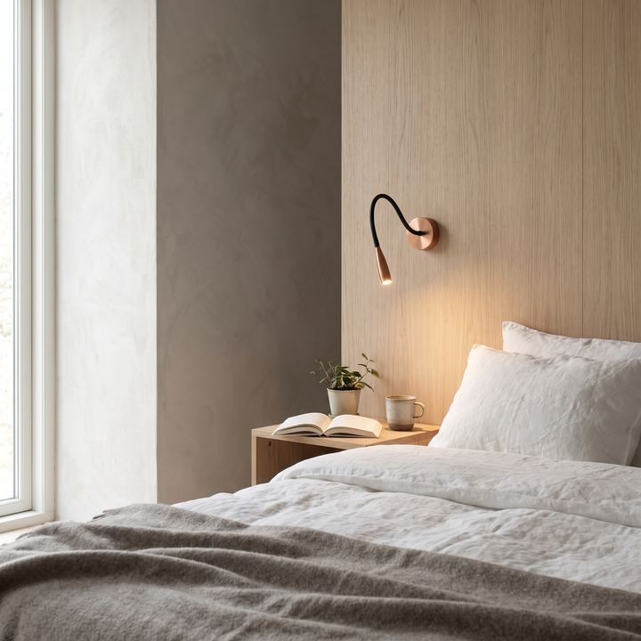 Thread slim copper LED wall sconce in a Scandinavian bedroom