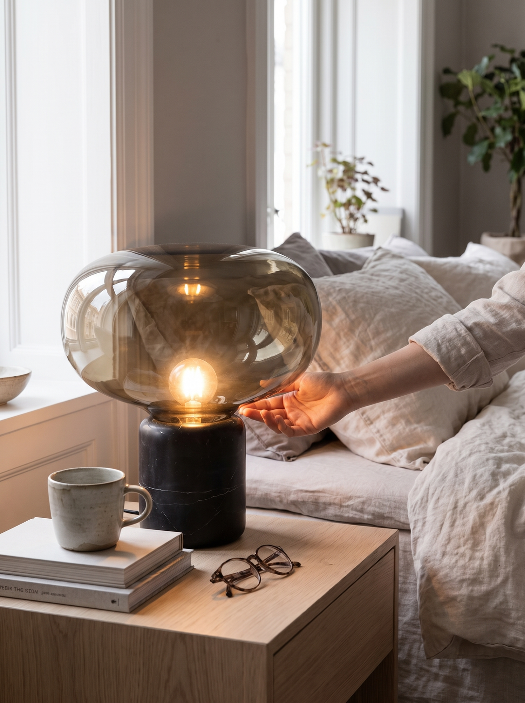 Smoked amber glass shade on the solid stone base of the Lumenorth Amber lamp