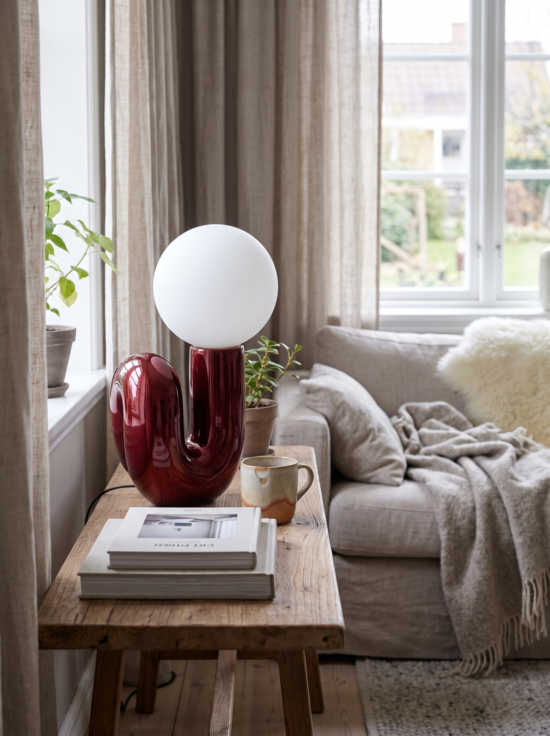 Lumenorth Loop Sculptural Table Lamp on a sideboard switched off