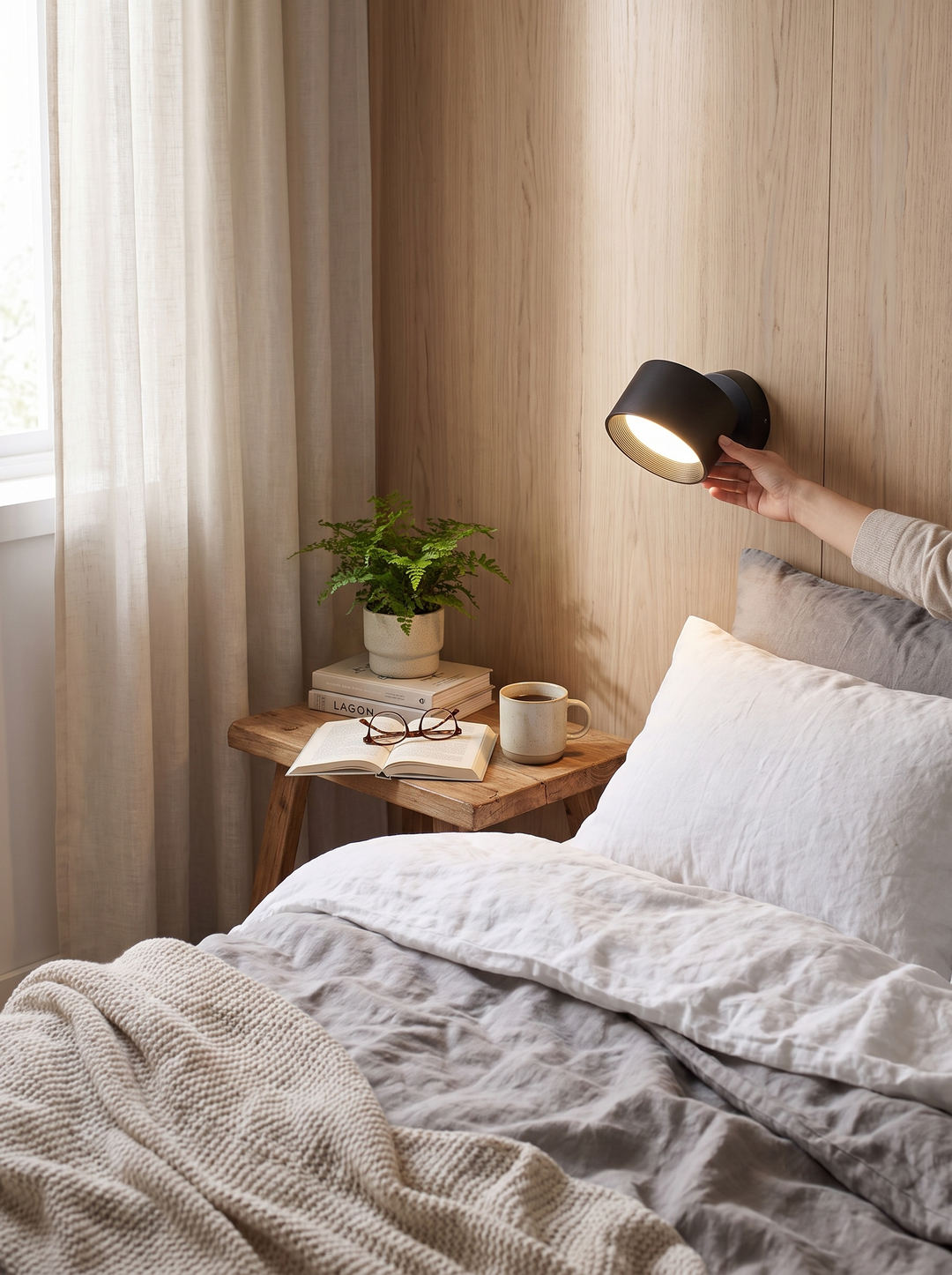 Lumenorth Nova Battery Wall Sconce beside a bed