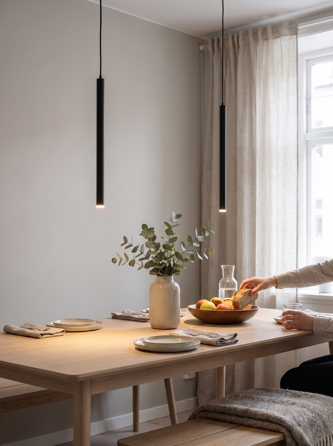 Slim upright profile of the Lumenorth Reed pendant
