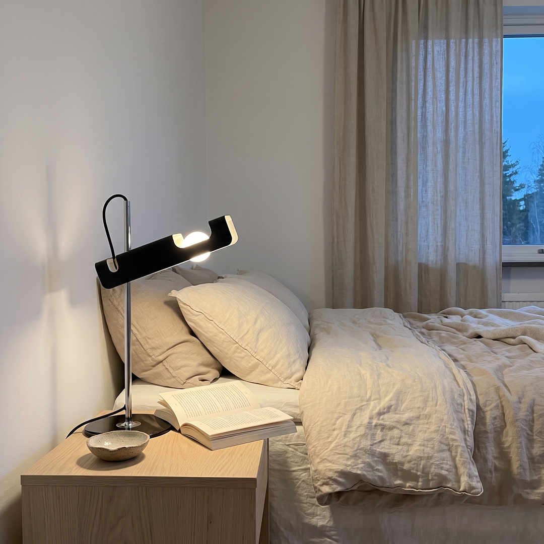 Pivot table lamp on a bedside table in a Scandinavian bedroom