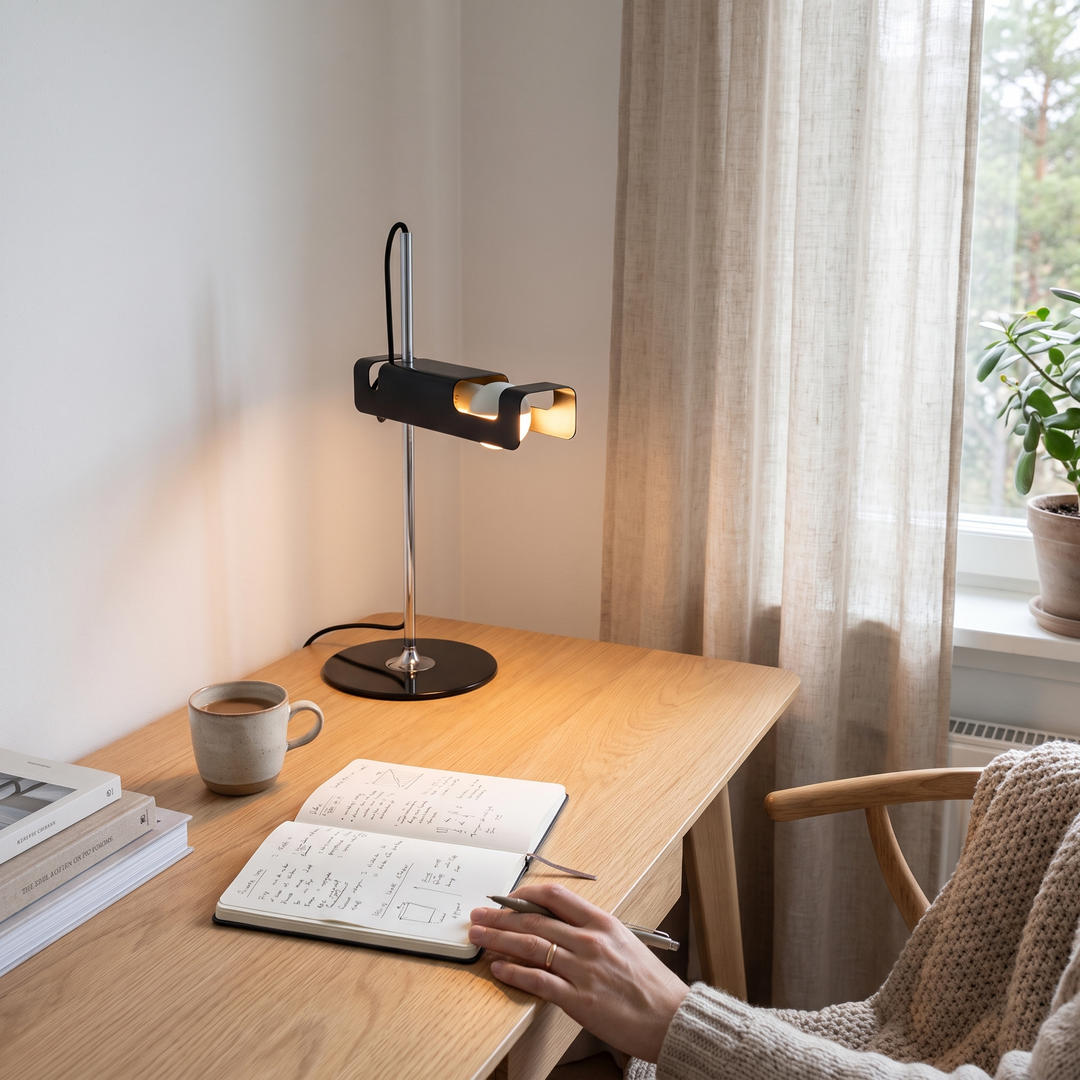 Pivot table lamp on an oak desk in a Scandinavian workspace