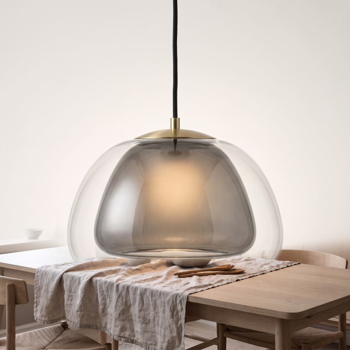 Smoked grey Drop glass globe pendant on a plain off-white background
